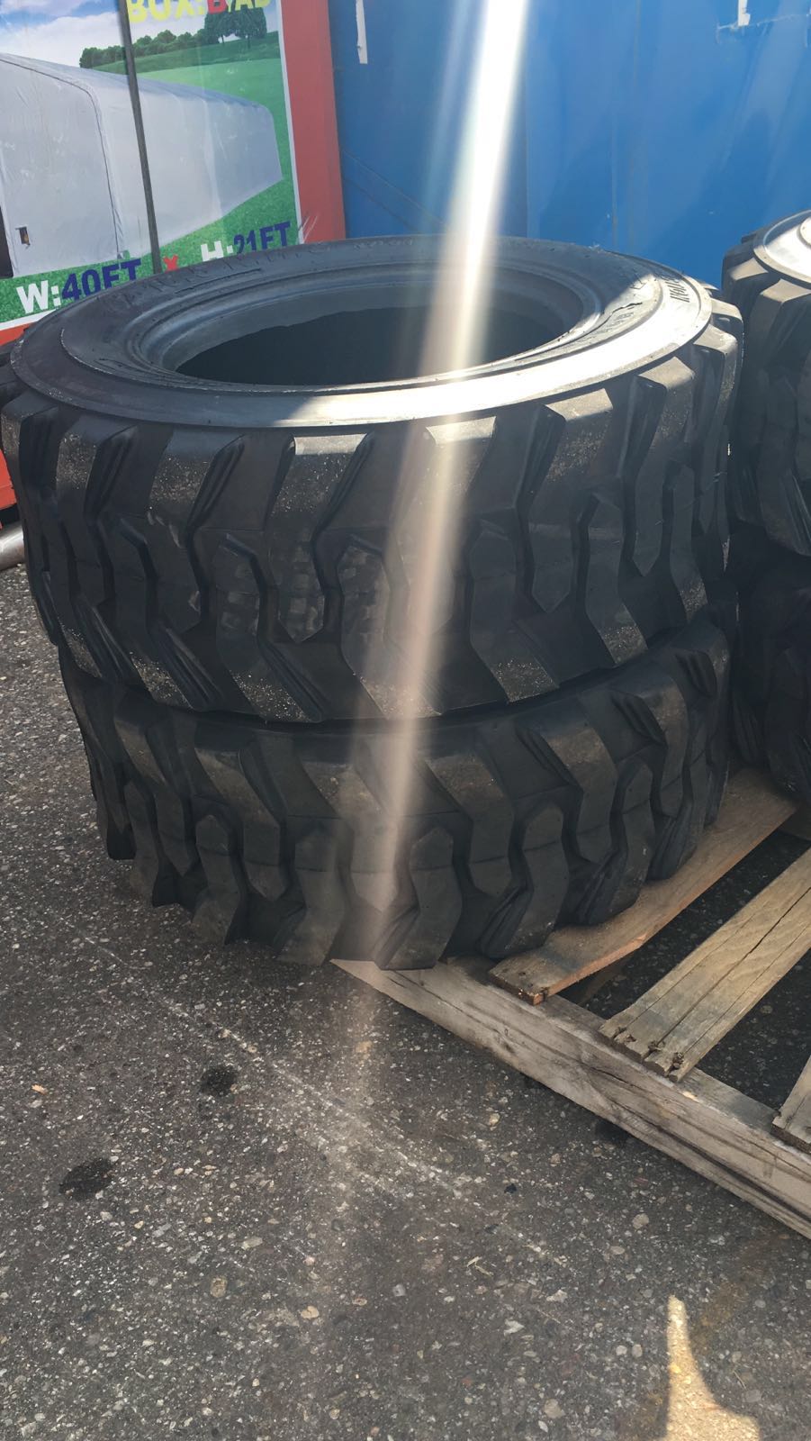 “Heavy duty skid steer tires with aggressive tread”

“SKS-1 and SKS-4 tires for Bobcat A300 and S750”

“Skid steer tires with red and silver rims”

“10x16.5 to 15x19.5 skid steer tire variants”

“Close-up of durable construction skid steer tire”

