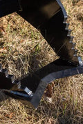Tree Grubber Attachment front view mounted on skid steer
Close-up of cutting edge removing root
Attachment digging under tree taproot
Brush and root removal tool in action