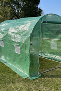 Spacious interior of heavy-duty walk-in dome roof greenhouse for plants