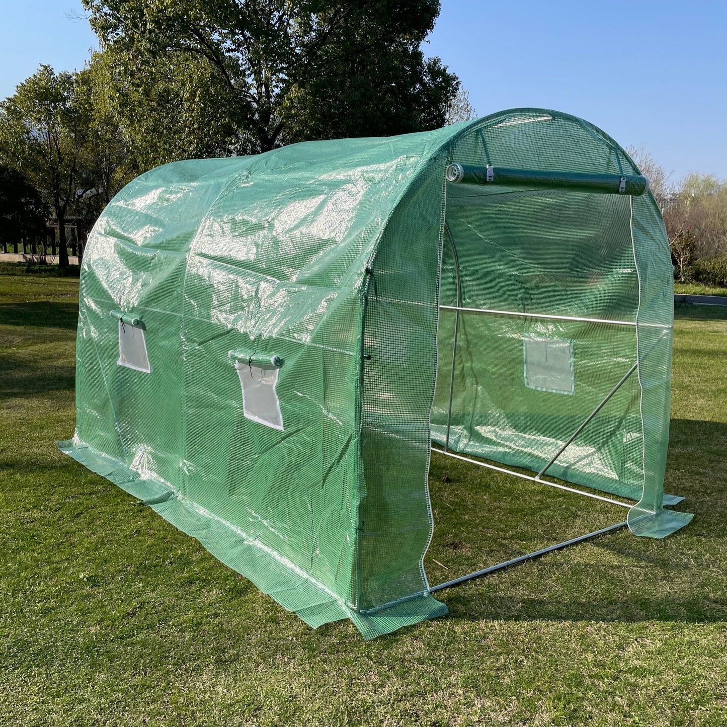 Spacious interior of heavy-duty walk-in dome roof greenhouse for plants