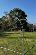 Tunnel greenhouse with zippered roll-up door for easy access