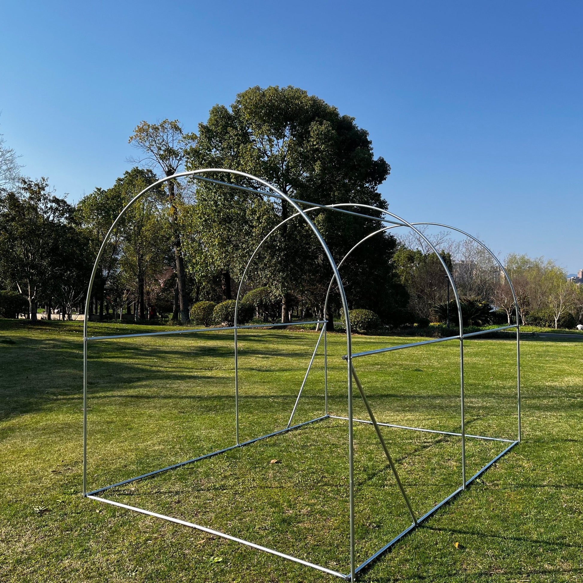 Tunnel greenhouse with zippered roll-up door for easy access