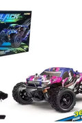 RC truck front view with purple detailing
RC truck side view showing 4WD build
All terrain tires with shock suspension
RC controller and accessories layout
Close-up of motor and battery system
RC truck in action outdoors