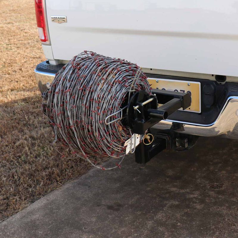 Barbed wire unroller mounted on a hitch
Fence wire roller with ATV adapter
Heavy-duty barbed wire dispenser close-up
Side profile of wire unroller
