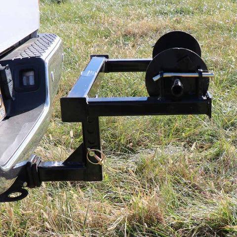 Barbed wire unroller mounted on a hitch
Fence wire roller with ATV adapter
Heavy-duty barbed wire dispenser close-up
Side profile of wire unroller