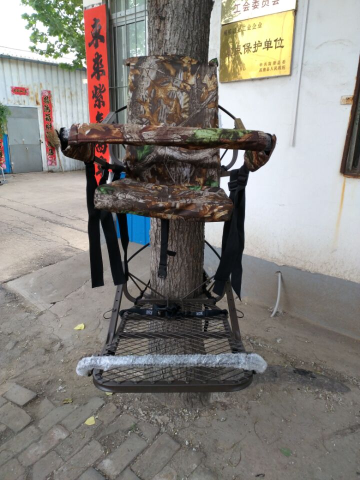 Closed-front hunting deer tree stand with Mossy Oak camo finish
Portable lightweight climbing tree stand for bowhunting
Steel frame deer stand setup on a tree outdoors
Deer stand footrest and seat dimensions close-up
Tree stand frame showing foldable design for easy transport