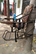 Closed-front hunting deer tree stand with Mossy Oak camo finish
Portable lightweight climbing tree stand for bowhunting
Steel frame deer stand setup on a tree outdoors
Deer stand footrest and seat dimensions close-up
Tree stand frame showing foldable design for easy transport