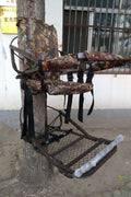 Closed-front hunting deer tree stand with Mossy Oak camo finish
Portable lightweight climbing tree stand for bowhunting
Steel frame deer stand setup on a tree outdoors
Deer stand footrest and seat dimensions close-up
Tree stand frame showing foldable design for easy transport