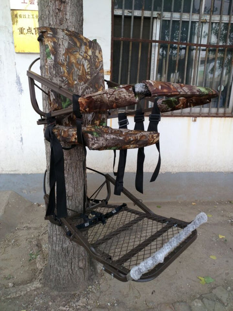 Closed-front hunting deer tree stand with Mossy Oak camo finish
Portable lightweight climbing tree stand for bowhunting
Steel frame deer stand setup on a tree outdoors
Deer stand footrest and seat dimensions close-up
Tree stand frame showing foldable design for easy transport