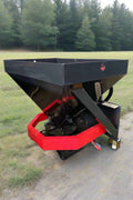 Skid Steer Tilt-N-Scoop Material Spreader front view
Side profile of spreader mounted on skid steer
Hydraulic spreader with sidewalk shield
Top view of hopper and agitator
Spreader attachment in action with sand
