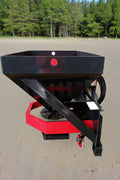 Skid Steer Tilt-N-Scoop Material Spreader front view
Side profile of spreader mounted on skid steer
Hydraulic spreader with sidewalk shield
Top view of hopper and agitator
Spreader attachment in action with sand