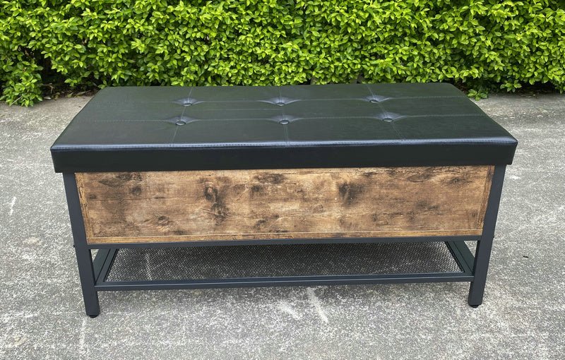 "Industrial Chesterfield-style storage bench ottoman with black metal frame, faux leather tufted top, and hidden trunk storage – Model TSLB2110"