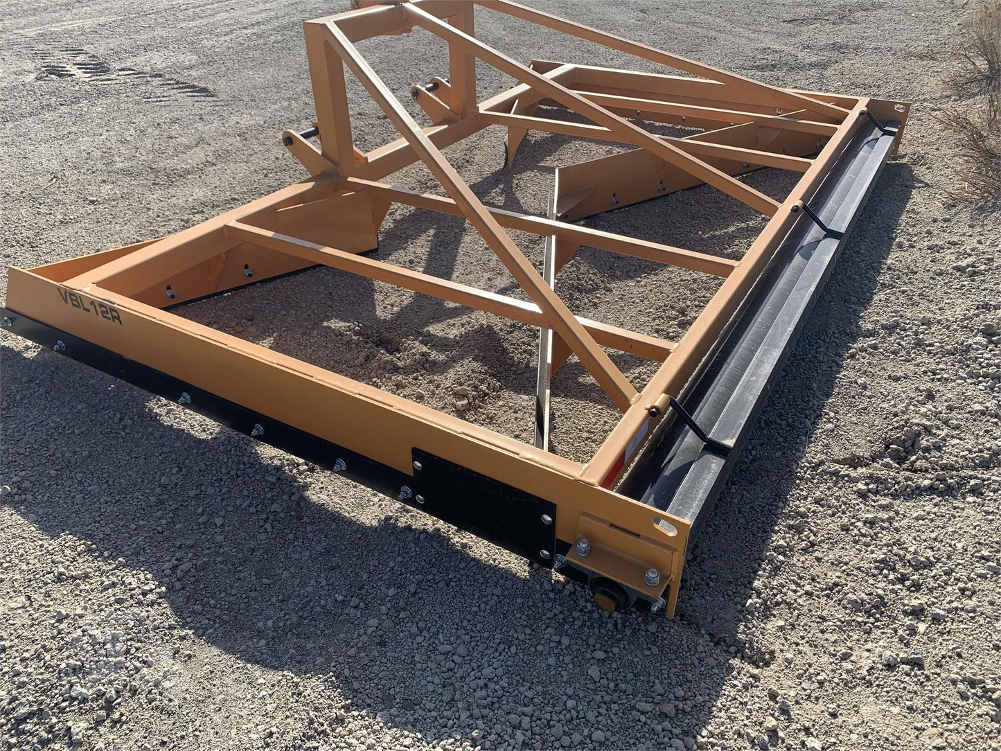 12 FT Box Scraper Float in Field – Side View
14 FT Industries America Box Scraper – Angled Front
Tractor Scraper Float with Gauge Roller Kit
Heavy-Duty Box Scraper for Land Grading
Orange Field Float Scraper – Rear Blade Design
