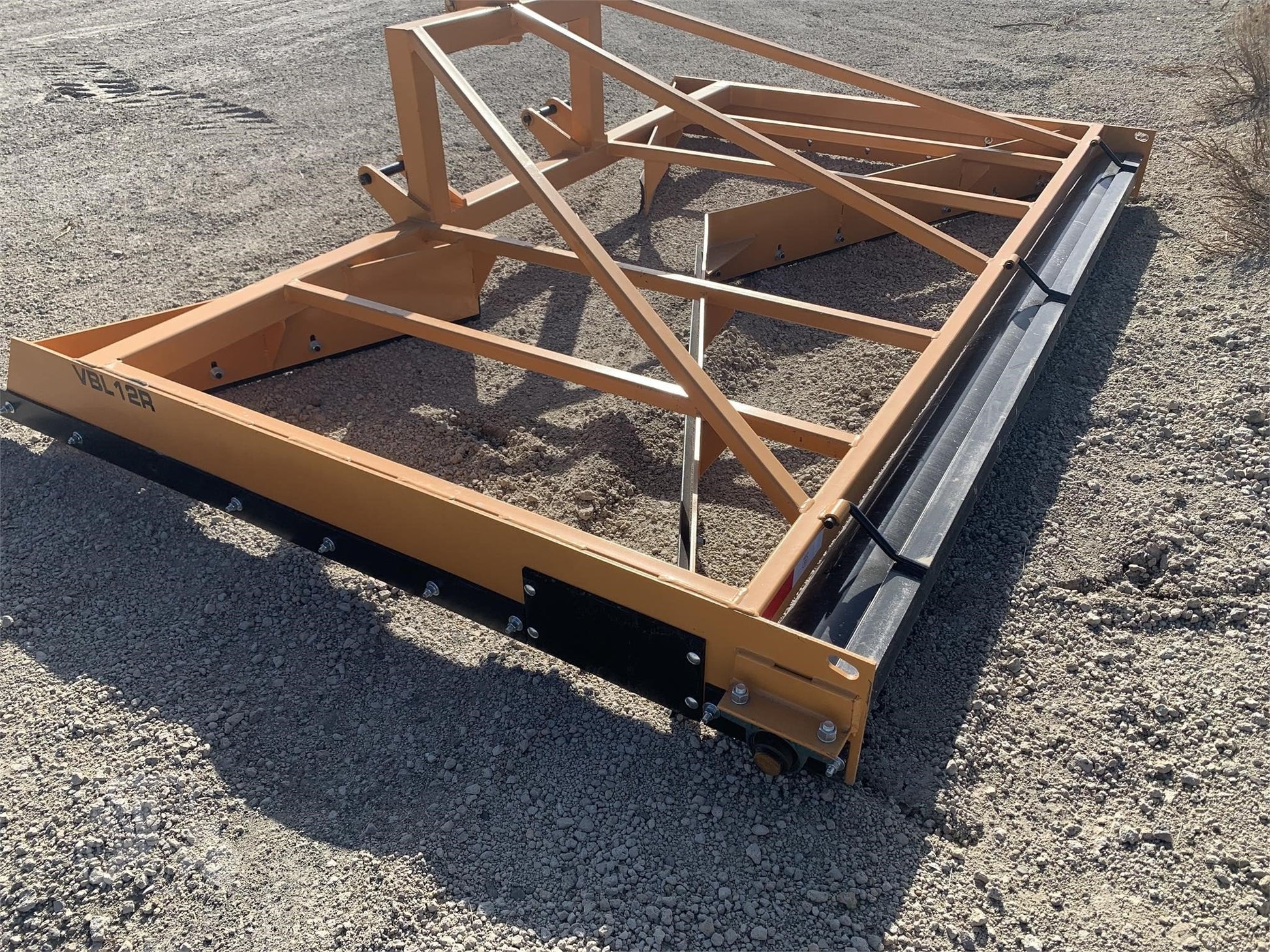 12 FT Box Scraper Float in Field – Side View
14 FT Industries America Box Scraper – Angled Front
Tractor Scraper Float with Gauge Roller Kit
Heavy-Duty Box Scraper for Land Grading
Orange Field Float Scraper – Rear Blade Design