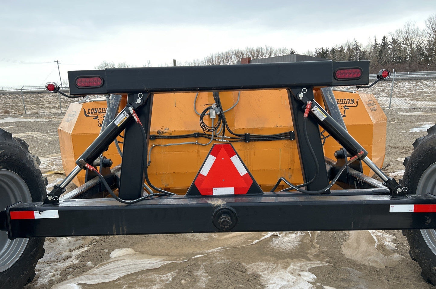Industries America 16 FT Hydraulic Pull Scraper – Side View on Tractor

Heavy-Duty Orange Scraper with Flotation Tires – Field Ready

16 Foot U-Blade Hydraulic Scraper for Earthmoving Projects

Tractor Attachment Scraper with Tilt Function – Rear Angle View