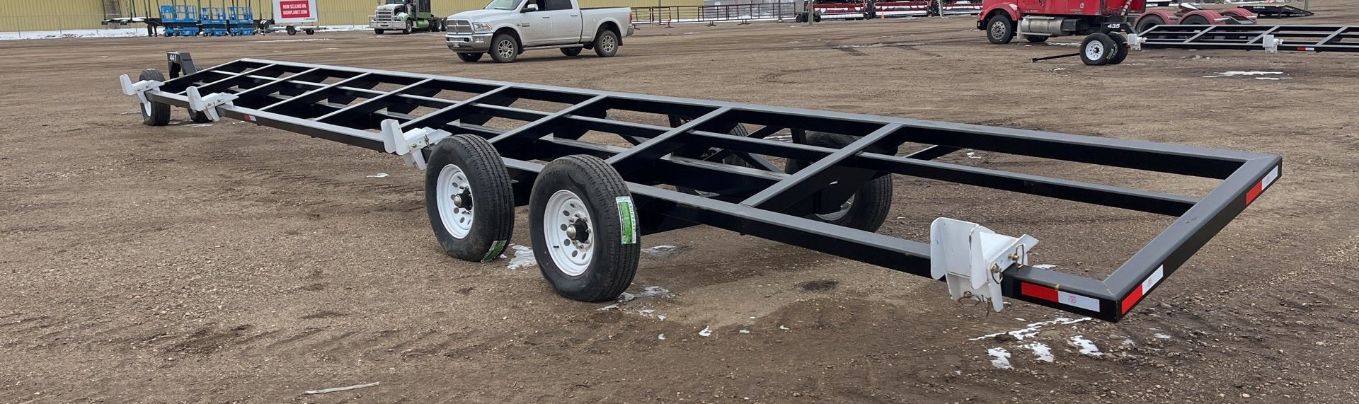 Industries America 441 Header Trailer – Side View with Bunks

41 FT Header Transport Trailer – Tandem Axle Design

Black Agricultural Header Trailer – Top Angle

Header Hauling Trailer with Adjustable Support Arms

Industrial 41 FT Trailer for Agricultural Equipment Transport