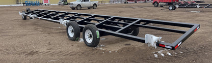 Industries America 441 Header Trailer – Side View with Bunks

41 FT Header Transport Trailer – Tandem Axle Design

Black Agricultural Header Trailer – Top Angle

Header Hauling Trailer with Adjustable Support Arms

Industrial 41 FT Trailer for Agricultural Equipment Transport