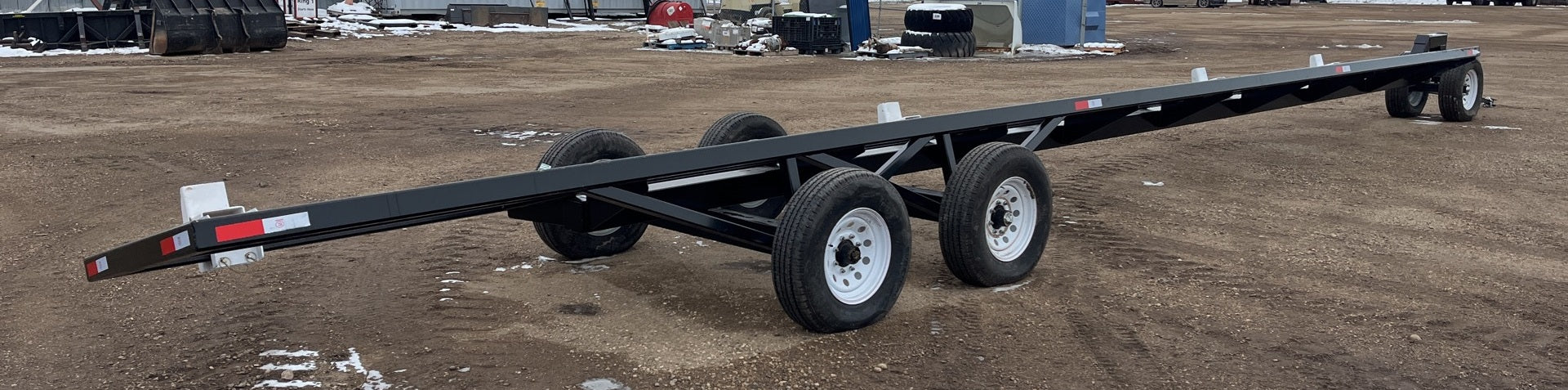 Industries America 441 Header Trailer – Side View with Bunks

41 FT Header Transport Trailer – Tandem Axle Design

Black Agricultural Header Trailer – Top Angle

Header Hauling Trailer with Adjustable Support Arms

Industrial 41 FT Trailer for Agricultural Equipment Transport