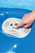 4-seat inflatable island float with sunshade
floating pool lounge with built-in cup holders
relaxing inflatable float for adults
inflatable pool island with cooler and speaker
heavy-duty lake float for 4 people