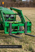 John Deere Euro Global 2-in-1 hay spear and pallet fork combo in use

Front view of the green hay spear attachment

Close-up of pallet fork mount

Forklift-style prongs on John Deere combo attachment

Side view of the detachable hay spear
