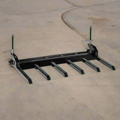 Clamp-on debris fork attachment on black tractor bucket – 60 inch
Green John Deere tractor with clamp-on fork attachment hauling debris
72-inch clamp-on debris forks mounted on front loader