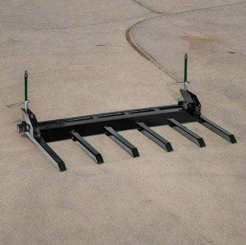 Clamp-on debris fork attachment on black tractor bucket – 60 inch
Green John Deere tractor with clamp-on fork attachment hauling debris
72-inch clamp-on debris forks mounted on front loader