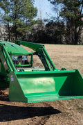 Green snow and mulch bucket attachment mounted on John Deere loader
High-capacity tractor loader bucket – front angle view