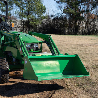 Green snow and mulch bucket attachment mounted on John Deere loader
High-capacity tractor loader bucket – front angle view