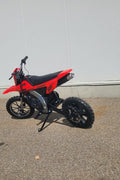 Red kids 36V electric dirt bike side view

Model CS3288 electric motocross bike for kids

Rear disc brake and suspension on 300W dirt bike

Young rider electric toy motorcycle CS3288

Knobby off-road tires on kids 36V electric bike
