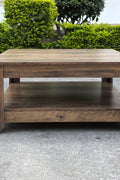Rustic knotty oak coffee table in a farmhouse-style living room
Side view showing woodgrain texture and lower shelf
Top-down view of the square table surface
Decorated coffee table with books and storage baskets
Compact rustic wood table styled with cozy furniture