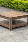 Rustic knotty oak coffee table in a farmhouse-style living room
Side view showing woodgrain texture and lower shelf
Top-down view of the square table surface
Decorated coffee table with books and storage baskets
Compact rustic wood table styled with cozy furniture