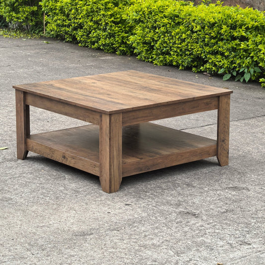 Rustic knotty oak coffee table in a farmhouse-style living room
Side view showing woodgrain texture and lower shelf
Top-down view of the square table surface
Decorated coffee table with books and storage baskets
Compact rustic wood table styled with cozy furniture