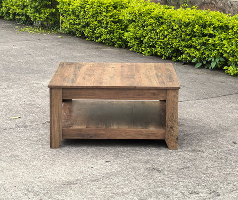 Rustic knotty oak coffee table in a farmhouse-style living room
Side view showing woodgrain texture and lower shelf
Top-down view of the square table surface
Decorated coffee table with books and storage baskets
Compact rustic wood table styled with cozy furniture