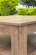 Rustic knotty oak coffee table in a farmhouse-style living room
Side view showing woodgrain texture and lower shelf
Top-down view of the square table surface
Decorated coffee table with books and storage baskets
Compact rustic wood table styled with cozy furniture