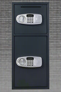 Double Door Digital Safe – Front View

Internal View of Dual Compartments

Safe with Open Drop Slot

Keypad Lock Close-Up

Steel Safe Mounted in Store

Secure Heavy-Duty Cash Safe

Interior with Included Keys