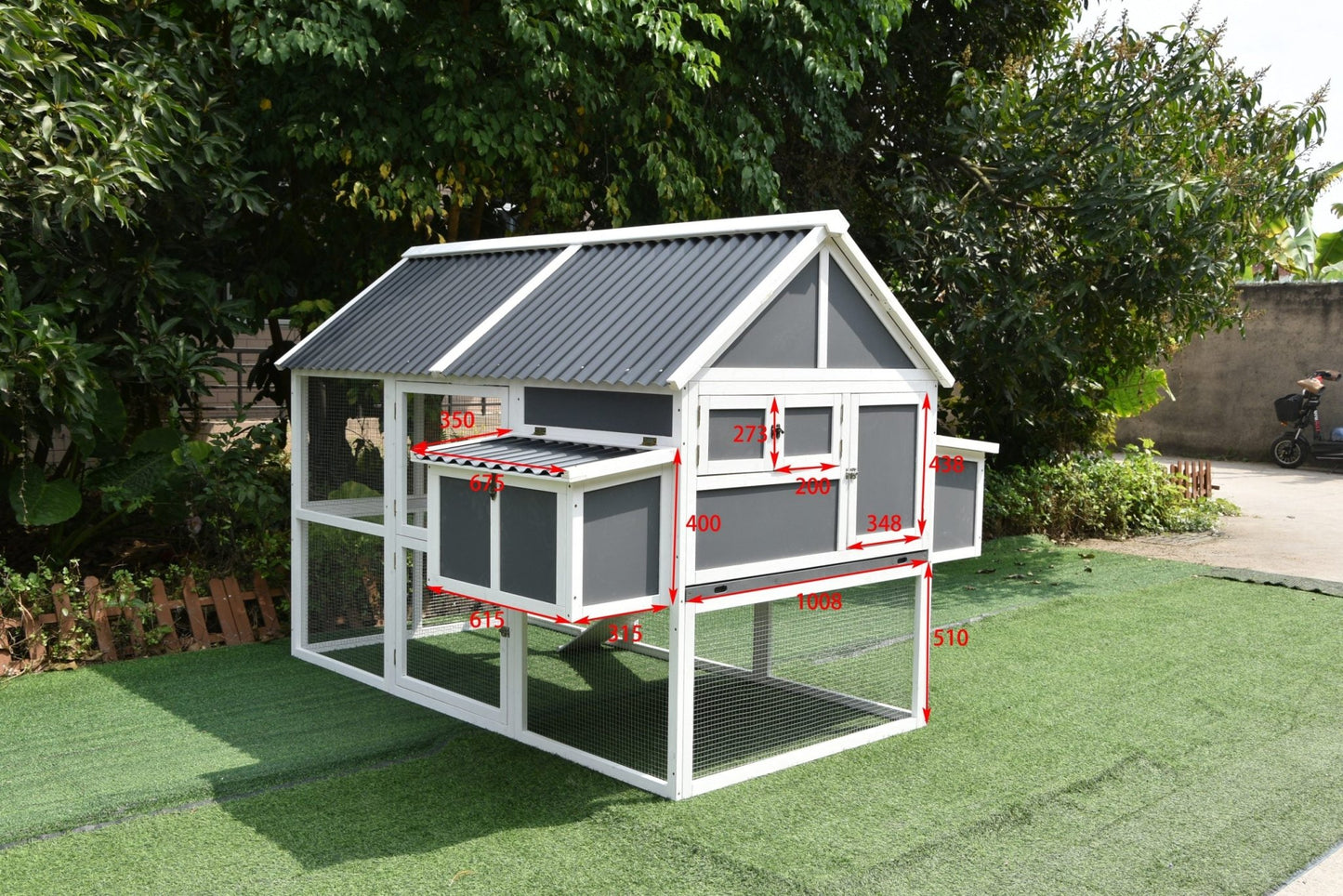 Outdoor rabbit hutch and chicken house with weather-resistant gray paint
