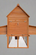 Large wooden backyard chicken coop with galvanized roof, nesting box, and walk-in run
