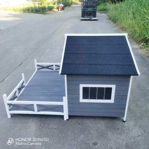 Large wooden raised outdoor dog house with porch – cabin-style weatherproof pet shelter
