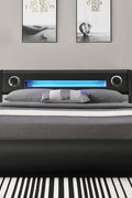 Modern black faux leather LED lift bed with Bluetooth speakers and storage – available in King and Queen