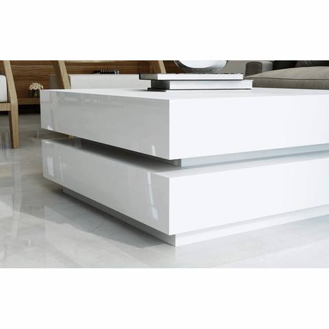 LED coffee table black gloss with ambient light in living room

White LED high gloss coffee table with modern decor

Top-down view of illuminated cubic coffee table

High gloss coffee table close-up with LED lighting effect

