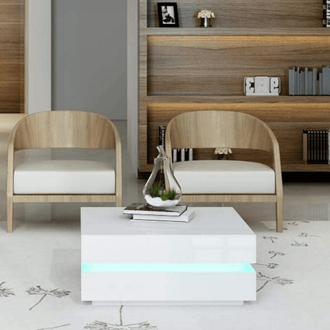 LED coffee table black gloss with ambient light in living room

White LED high gloss coffee table with modern decor

Top-down view of illuminated cubic coffee table

High gloss coffee table close-up with LED lighting effect

