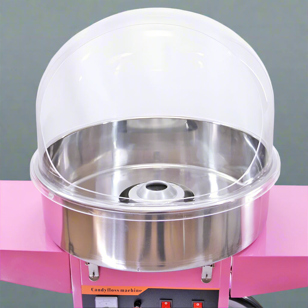 Pink Candy Floss Machine with Dome Cover – Front View

Commercial Cotton Candy Machine – Close-Up of Controls

Candy Floss Cart with Wheels – Party Setup

Dome Cover Cotton Candy Maker – Rear View

Pink Cotton Candy Machine in Use – Carnival Event