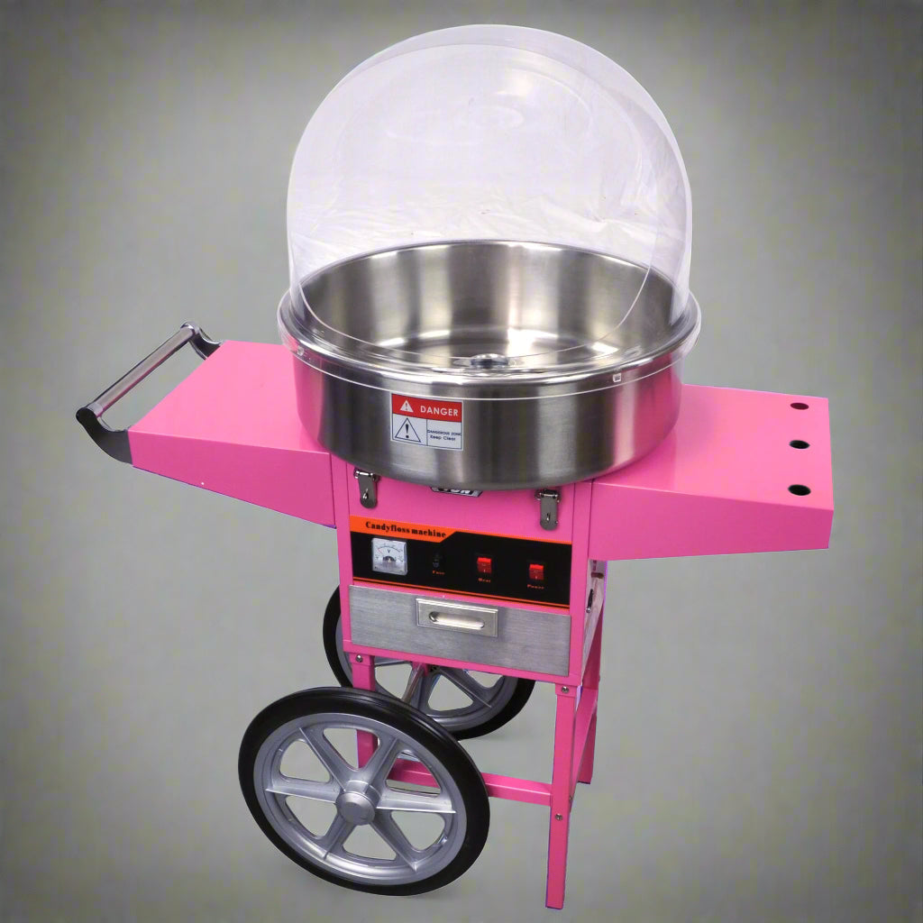 Pink Candy Floss Machine with Dome Cover – Front View

Commercial Cotton Candy Machine – Close-Up of Controls

Candy Floss Cart with Wheels – Party Setup

Dome Cover Cotton Candy Maker – Rear View

Pink Cotton Candy Machine in Use – Carnival Event