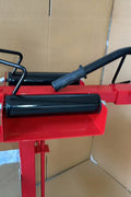 Manual tire changer and spreader stand with red base and swivel platform
Tire changer stand showing adjustable tilt function and tool tray
Manual tire repair stand for light truck tires in auto repair garage