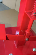 Manual tire changer and spreader stand with red base and swivel platform
Tire changer stand showing adjustable tilt function and tool tray
Manual tire repair stand for light truck tires in auto repair garage