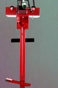 Manual tire changer and spreader stand with red base and swivel platform
Tire changer stand showing adjustable tilt function and tool tray
Manual tire repair stand for light truck tires in auto repair garage