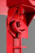 Manual tire changer and spreader stand with red base and swivel platform
Tire changer stand showing adjustable tilt function and tool tray
Manual tire repair stand for light truck tires in auto repair garage