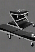 Mechanics creeper rolling cart with padded vinyl surface

Convertible garage seat and creeper with 6 caster wheels

Black auto repair creeper with metal frame and seat

S1066 rolling creeper seat in upright position for repairs
