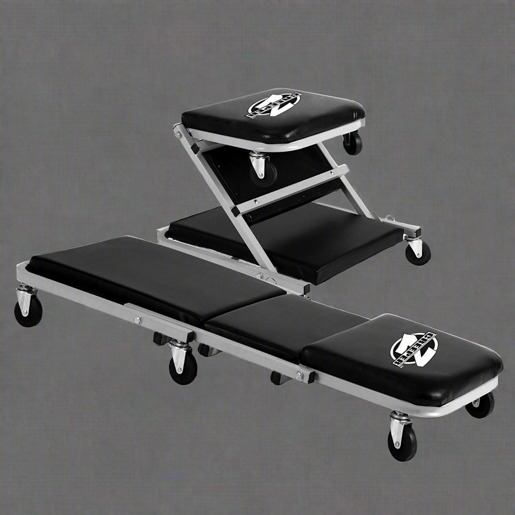 Mechanics creeper rolling cart with padded vinyl surface

Convertible garage seat and creeper with 6 caster wheels

Black auto repair creeper with metal frame and seat

S1066 rolling creeper seat in upright position for repairs