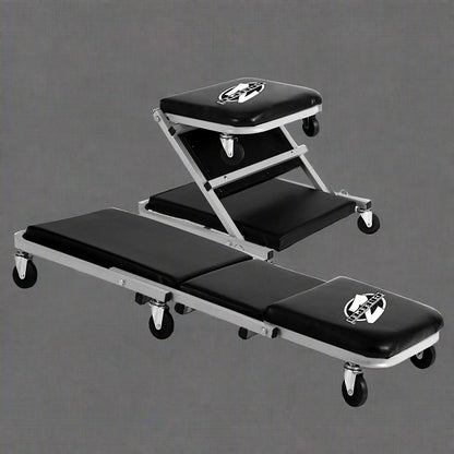 Mechanics creeper rolling cart with padded vinyl surface

Convertible garage seat and creeper with 6 caster wheels

Black auto repair creeper with metal frame and seat

S1066 rolling creeper seat in upright position for repairs